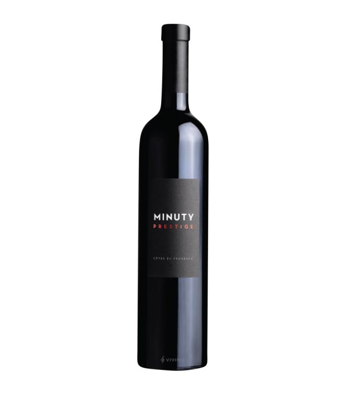 Château Minuty Prestige Rouge boca crvenog vina s etiketom brenda.